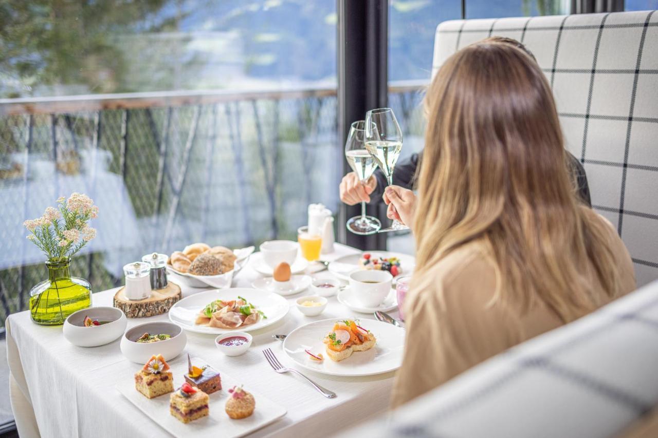 My Arbor - Dolomites Hotell Brixen Exteriör bild A woman enjoying a meal at a restaurant